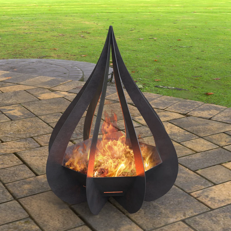 Modern outdoor fire pit with flames on a patio